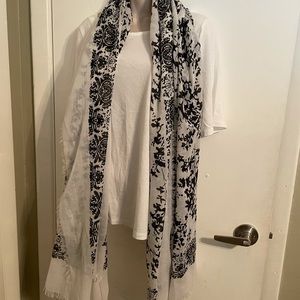 Black and white scarf. 80” square. Fringed.